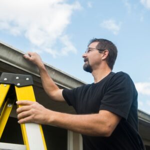Man inspecting his roof