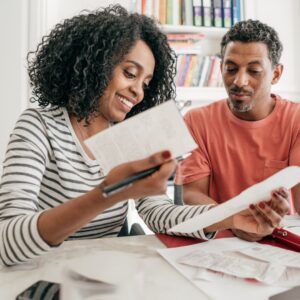 Two people looking at finances