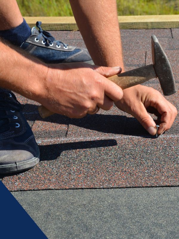 working on shingle roof